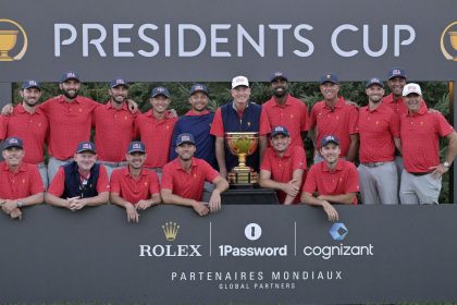 Team USA poses with the trophy after winning the 2024 Presidents Cup at Royal Montreal Golf Club in Quebec, Canada.