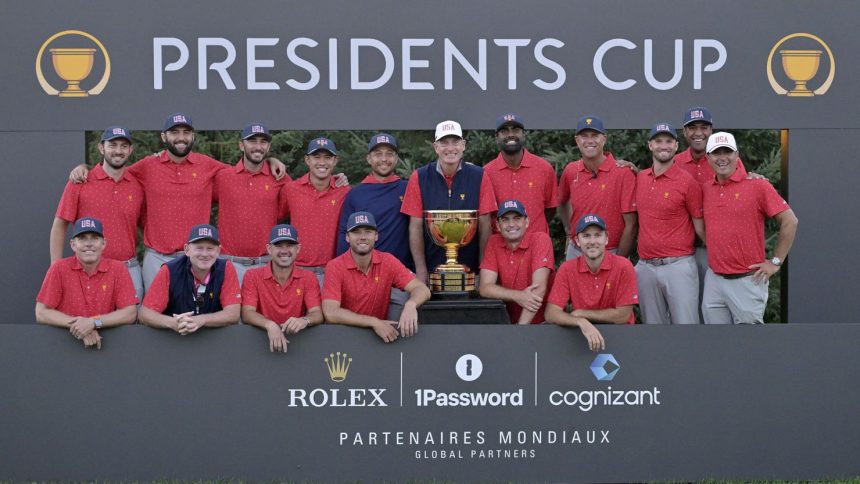 Team USA poses with the trophy after winning the 2024 Presidents Cup at Royal Montreal Golf Club in Quebec, Canada.