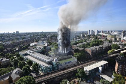 LONDON, ENGLAND - JUNE 14:  Smoke rises from the building after a huge fire engulfed the 24 storey residential Grenfell Tower block in Latimer Road, West London in the early hours of this morning on June 14, 2017 in London, England.  The Mayor of London, Sadiq Khan, has declared the fire a major incident as more than 200 firefighters are still tackling the blaze while at least 50 people are receiving hospital treatment.  (Photo by Leon Neal/Getty Images)