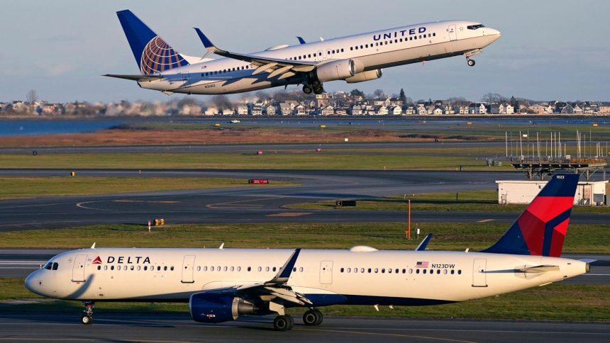 A United Airlines jet takes off while a Delta Air Lines plane taxis at Logan International Airport in Boston.