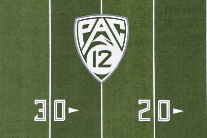 The Pac-12 Conference logo on the Autzen Stadium football field at the University of Oregon.