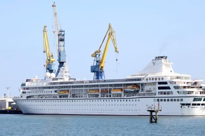 The Villa Vie Odyssey was due to leave in May, but is still in the harbor at Belfast.