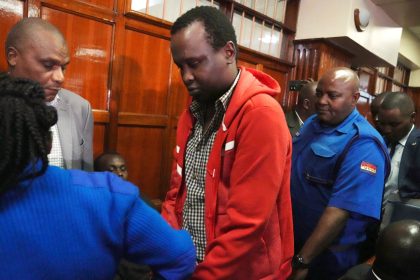 Kevin Adam Kinyanjui Kangethe is escorted out of a courtroom in Nairobi, Kenya, on February 14, 2024. He was extradited Sunday to the US to face murder charges.