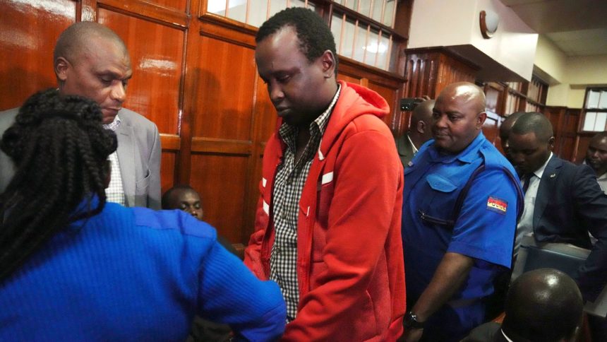 Kevin Adam Kinyanjui Kangethe is escorted out of a courtroom in Nairobi, Kenya, on February 14, 2024. He was extradited Sunday to the US to face murder charges.