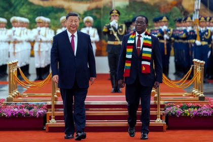 Chinese leader Xi Jinping, left, and Zimbabwe's President Emmerson Mnangagwa review an honor guard during a welcome ceremony at the Great Hall of the People in Beijing on September 2, ahead of the Forum on China and Africa Cooperation.