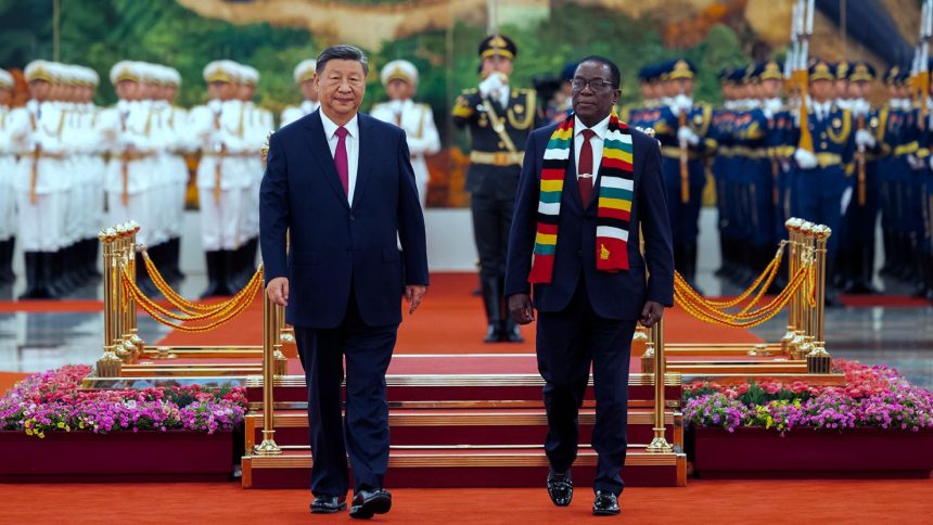 Chinese leader Xi Jinping, left, and Zimbabwe's President Emmerson Mnangagwa review an honor guard during a welcome ceremony at the Great Hall of the People in Beijing on September 2, ahead of the Forum on China and Africa Cooperation.