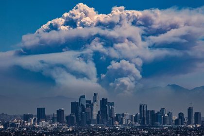 A giant pyrocumulus cloud forms above the Bridge Fire, which is burned in the San Gabriel mountains behind downtown Los Angeles this year.