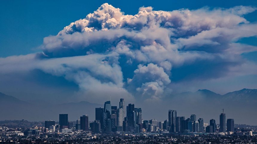 A giant pyrocumulus cloud forms above the Bridge Fire, which is burned in the San Gabriel mountains behind downtown Los Angeles this year.