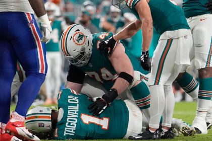 Miami Dolphins quarterback Tua Tagovailoa lies on the field after suffering what his team says was a concussion during the second half in Thursday's game against the Buffalo Bills in Miami Gardens, Florida.