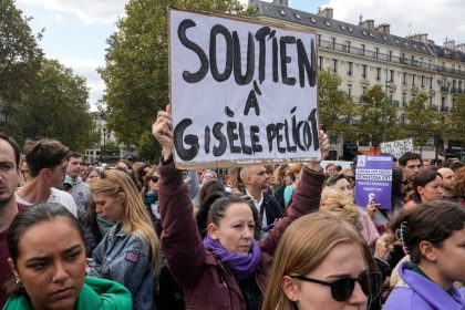 People take part in a gathering in support of 71-year-old Gisele Pelicot on Saturday, Sept. 14, 2024 in Paris. Placard reads, "support for Gisèle Pélicot."