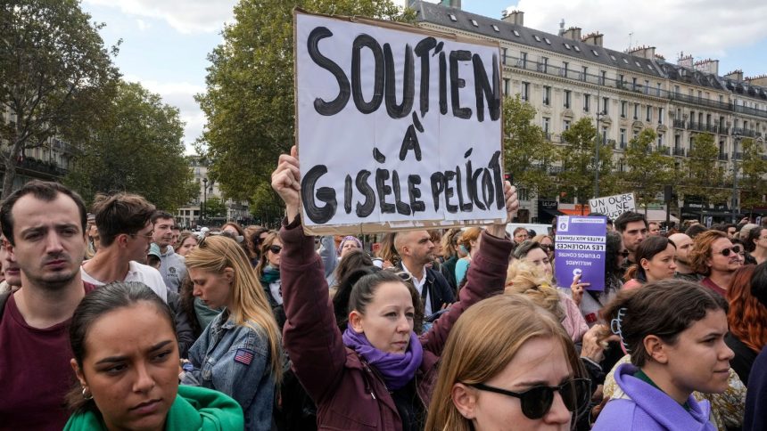 People take part in a gathering in support of 71-year-old Gisele Pelicot on Saturday, Sept. 14, 2024 in Paris. Placard reads, "support for Gisèle Pélicot."