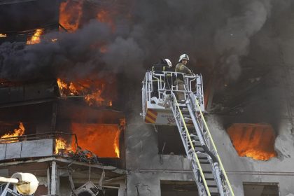 Firefighters tackle a blaze after a Russian aerial bomb struck a multi-story residential building in Kharkiv, Ukraine, Sunday Sept. 15, 2024.