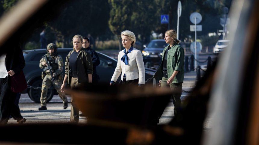 President of the European Commission Ursula von der Leyen, center, on her way to visit a memorial wall commemorating fallen Ukrainian soldiers in the war with Russia, in Kyiv, on September 20.