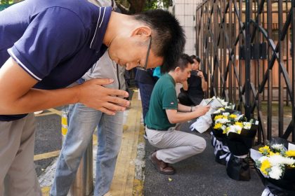 Shenzhen residents lay flowers and mourn a 10-year-old Japanese boy fatally stabbed on his way to school in the southern Chinese city.