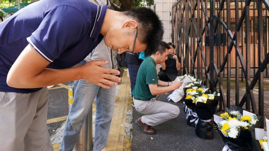 Shenzhen residents lay flowers and mourn a 10-year-old Japanese boy fatally stabbed on his way to school in the southern Chinese city.