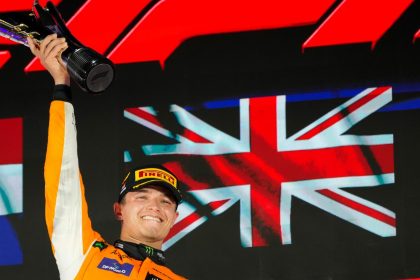 McLaren driver Lando Norris of Britain celebrates on the podium after winning the Singapore Formula One Grand Prix at the Marina Bay Street Circuit, in Singapore.