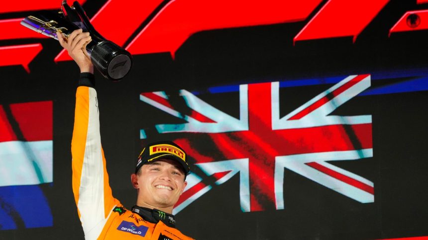 McLaren driver Lando Norris of Britain celebrates on the podium after winning the Singapore Formula One Grand Prix at the Marina Bay Street Circuit, in Singapore.