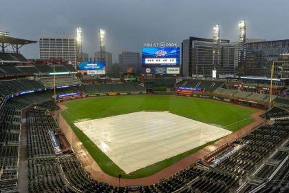 A tarp covers the infield as rain comes down at Truist Park in Atlanta after both Wednesday and Thursday New York Mets-Atlanta Braves games were postponed due to inclement weather.