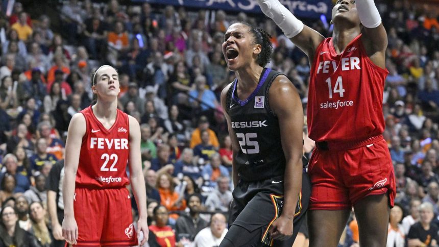 Connecticut Sun forward Alyssa Thomas celebrates during her team's series-sealing win over the Indiana Fever.