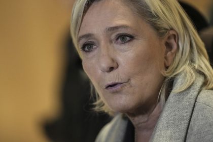 Marine Le Pen speaks to the media as she arrives at the court house in Paris, Monday, September 30, 2024.