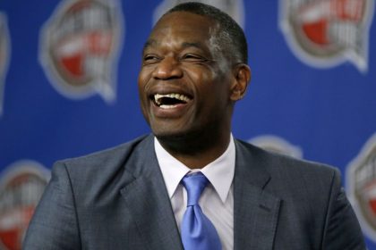 FILE - Former NBA basketball player Dikembe Mutombo laughs during a news conference announcing him as one of the 12 finalists of this year's hall of fame class during an event ahead of the NBA All Star basketball game, on Feb. 14, 2015, in New York. (AP Photo/Julio Cortez, File)