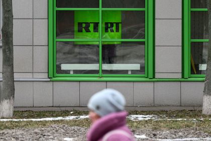 This photograph taken in Moscow on January 22, 2023 shows the logo of RT (Russia Today) TV channel displayed at the company headquarters.