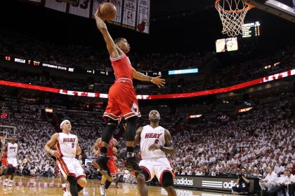 Derrick Rose (middle), seen here dunking in front of Miami's Mike Bibby (No. 0) and LeBron James (No. 6) in the 2011 NBA Playoffs, announced he has retired from professional basketball.