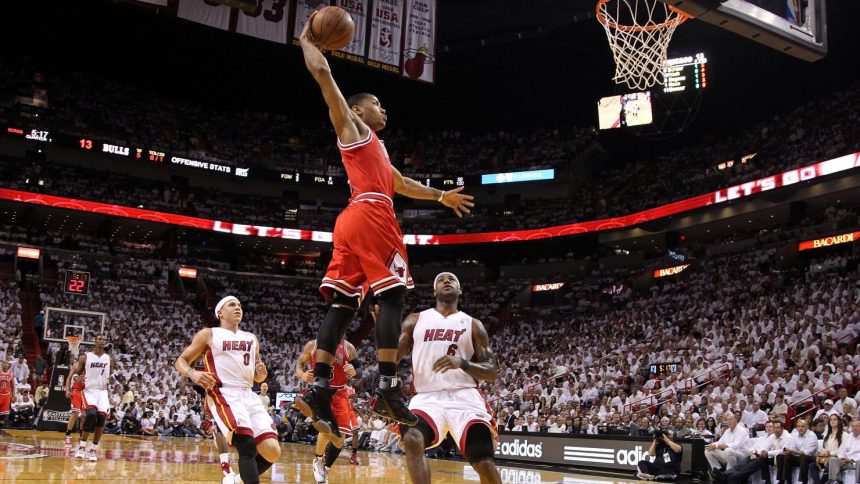 Derrick Rose (middle), seen here dunking in front of Miami's Mike Bibby (No. 0) and LeBron James (No. 6) in the 2011 NBA Playoffs, announced he has retired from professional basketball.