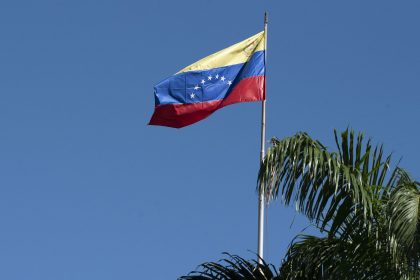 The Venezuelan flag flies over the National Assembly building in Caracas, Venezuela.