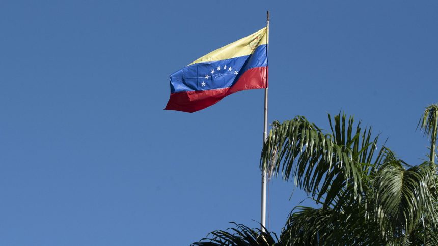 The Venezuelan flag flies over the National Assembly building in Caracas, Venezuela.