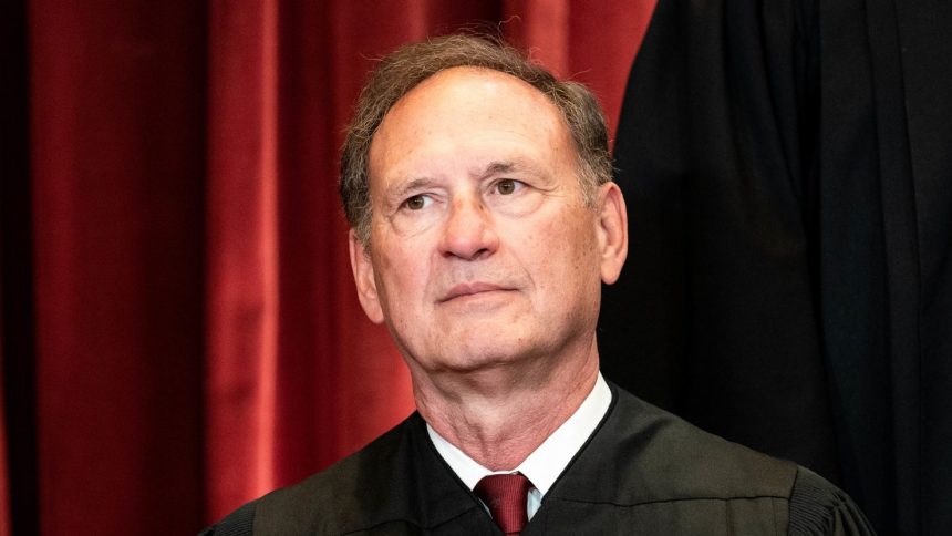 Associate Justice Samuel Alito sits during a group photo of the Justices at the Supreme Court in Washington, DC on April 23, 2021.