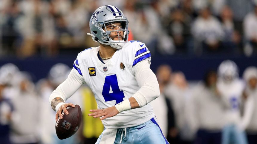 Dak Prescott of the Dallas Cowboys drops back to pass during the NFC Wild Card Playoff game against the Green Bay Packers on January 14, 2024.