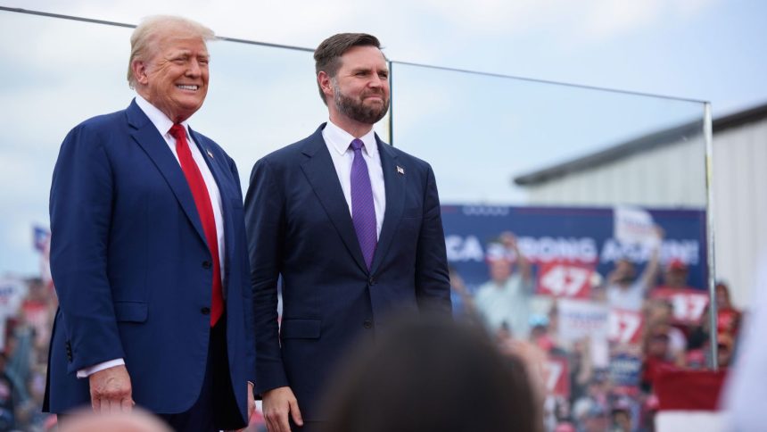 Republican Presidential candidate, former US president, Donald Trump, left, poses for photos with Republican Vice Presidential candidate, U.S. Sen. J.D. Vance.