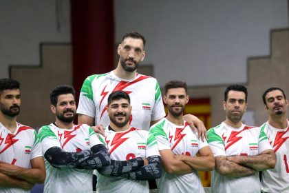 Morteza Mehrzadselakjani (top center) poses for a picture with his Iranian teammates during a training session of the men's sitting volleyball team ahead of the 2024 Paralympics Paris Games.