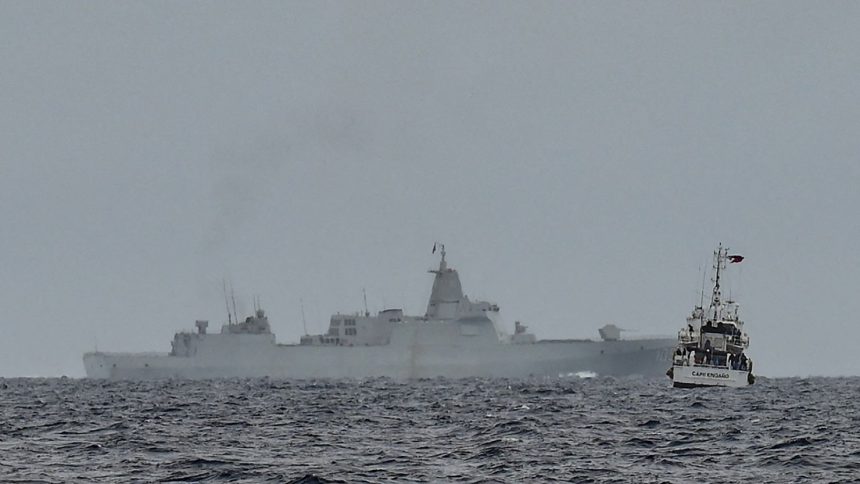 A vessel identified by the Philippine Coast Guard as a Chinese naval ship operates in the South China Sea on August 26.