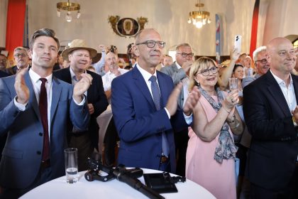 Joerg Urban, center-left, lead candidate of the far-right Alternative for Germany (AfD) in the state of Saxony, and AfD supporters gather for the results in the Saxony state elections on September 1, 2024 in Dresden, Germany.