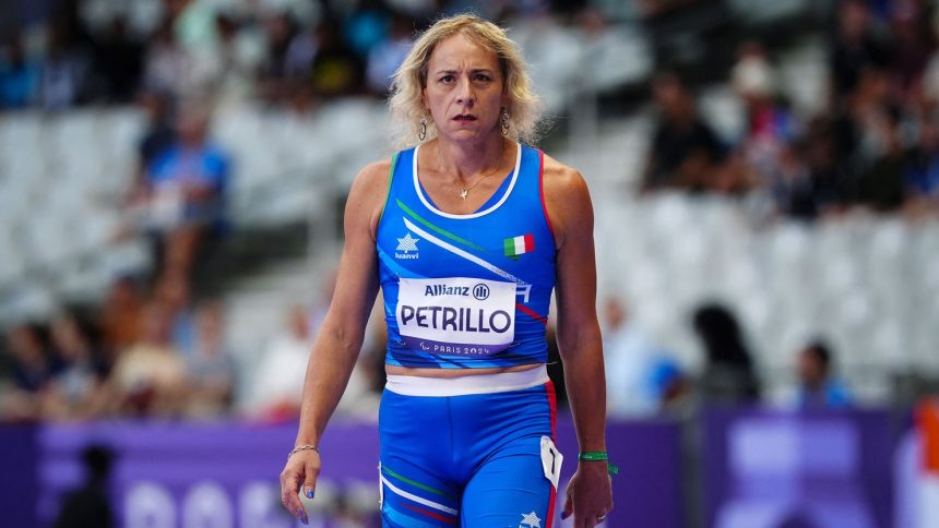 Italy's Valentina Petrillo prepares to compete in the women's 400m T12 athletic event at the Paris 2024 Paralympic Games at the Stade de France.