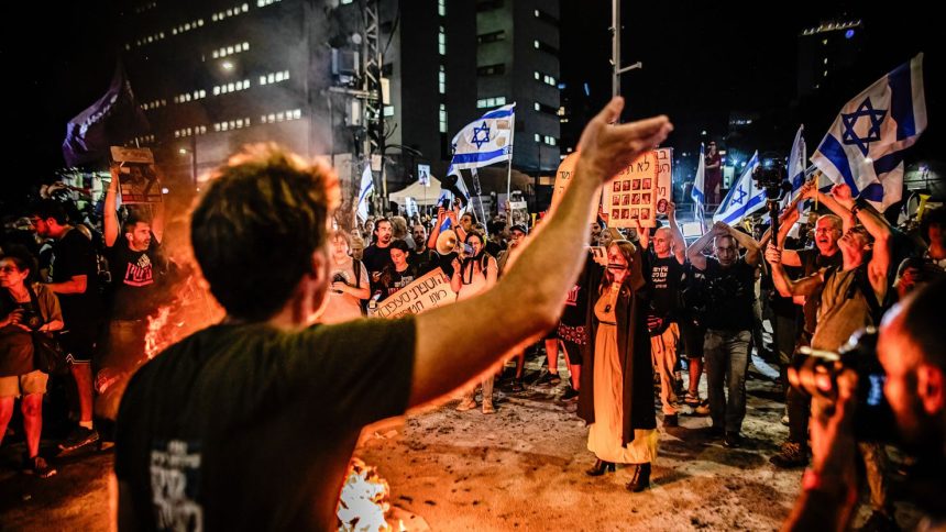 Israeli protesters in Tel Aviv chant slogans during a demonstration on Tuesday, three days after the bodies of six hostages were rescued from Gaza.