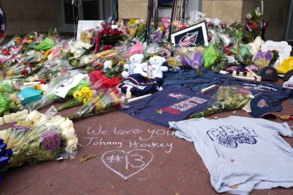 Fans build a memorial outside of Nationwide Arena in honor of the late Columbus Blue Jackets forward Johnny Gaudreau.