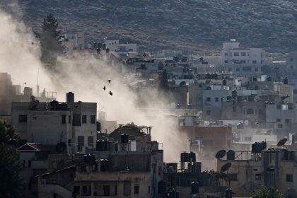 Smoke rises during an Israeli military raid in Jenin in the occupied West Bank on Thursday.