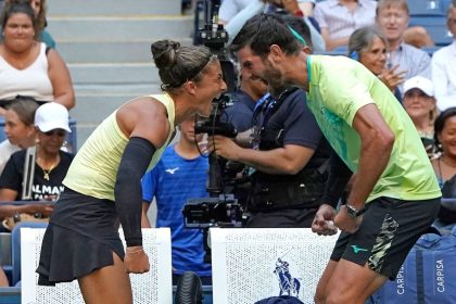 Errani and partner Andrea Vavassori celebrate winning the US Open mixed doubles title.