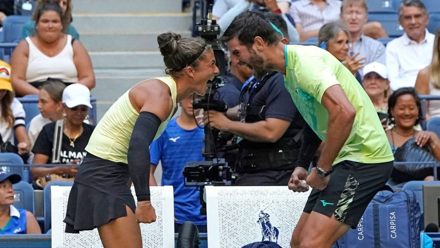 Errani and partner Andrea Vavassori celebrate winning the US Open mixed doubles title.