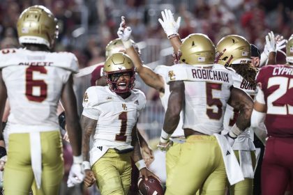 Boston College players celebrate after Thomas Castellanos (No. 1) scores a touchdown during the first half against the Florida State Seminoles.