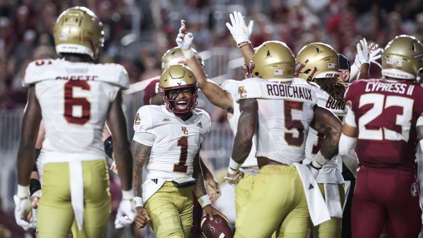 Boston College players celebrate after Thomas Castellanos (No. 1) scores a touchdown during the first half against the Florida State Seminoles.