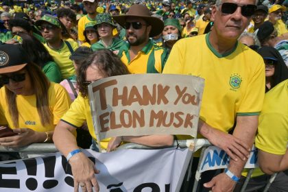 Supporters of former Brazilian President Jair Bolsonaro hold a sign thanking X social media platform owner Elon Musk, during an Independence day rally in Sao Paulo, Brazil, on September 7, 2024.