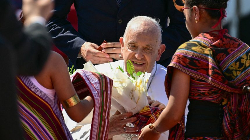 Pope Francis is greeted at Presidente Nicolau Lobato International Airport in Dili, East Timor, on September 9, 2024.