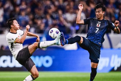 Yang Zexiang of Team China and Kaoru Mitoma of Team Japan compete for the ball during the 2026 FIFA World Cup Qualifier match between China and Japan at Saitama Stadium on September 5, 2024.