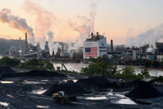 Bulldozers move coal near US Steel's Clairton Coke Works facility in Clairton, Pennsylvania on September 9.