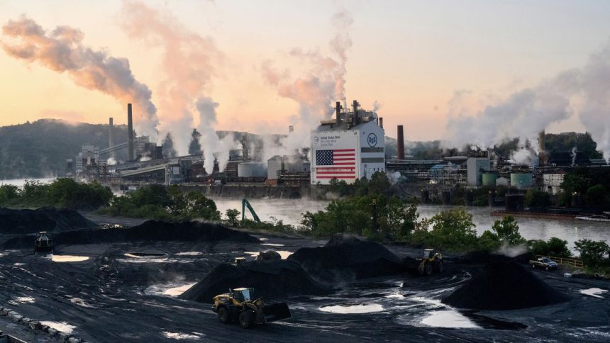 Bulldozers move coal near US Steel's Clairton Coke Works facility in Clairton, Pennsylvania on September 9.