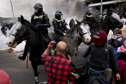 Protesters confront police outside the Land Forces 2024 arms fair in Melbourne on September 11, 2024.